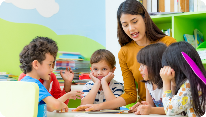 Teacher and students in a classroom setting.